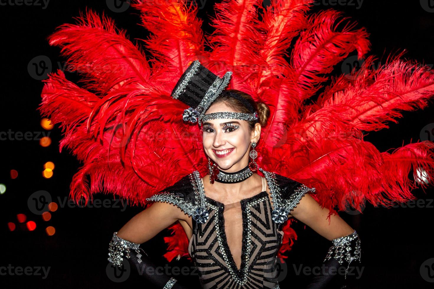 Brazilian wearing Samba Costume. Beautiful Brazilian woman wearing colorful costume and smiling during Carnaval street parade in Brazil. photo