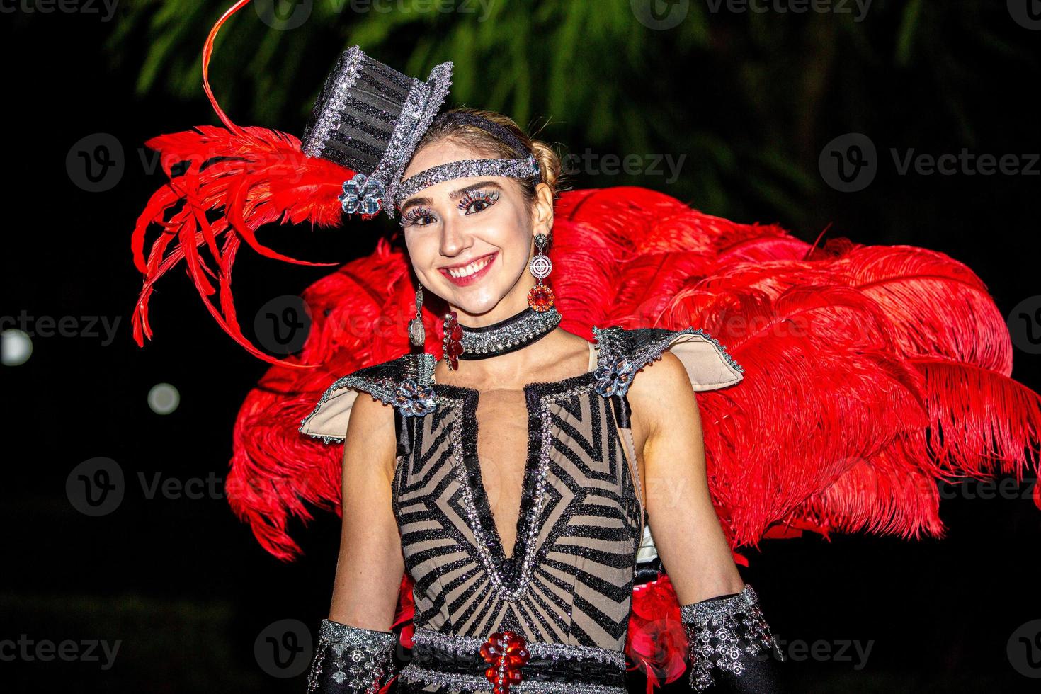 Brazilian wearing Samba Costume. Beautiful Brazilian woman wearing colorful costume and smiling during Carnaval street parade in Brazil. photo
