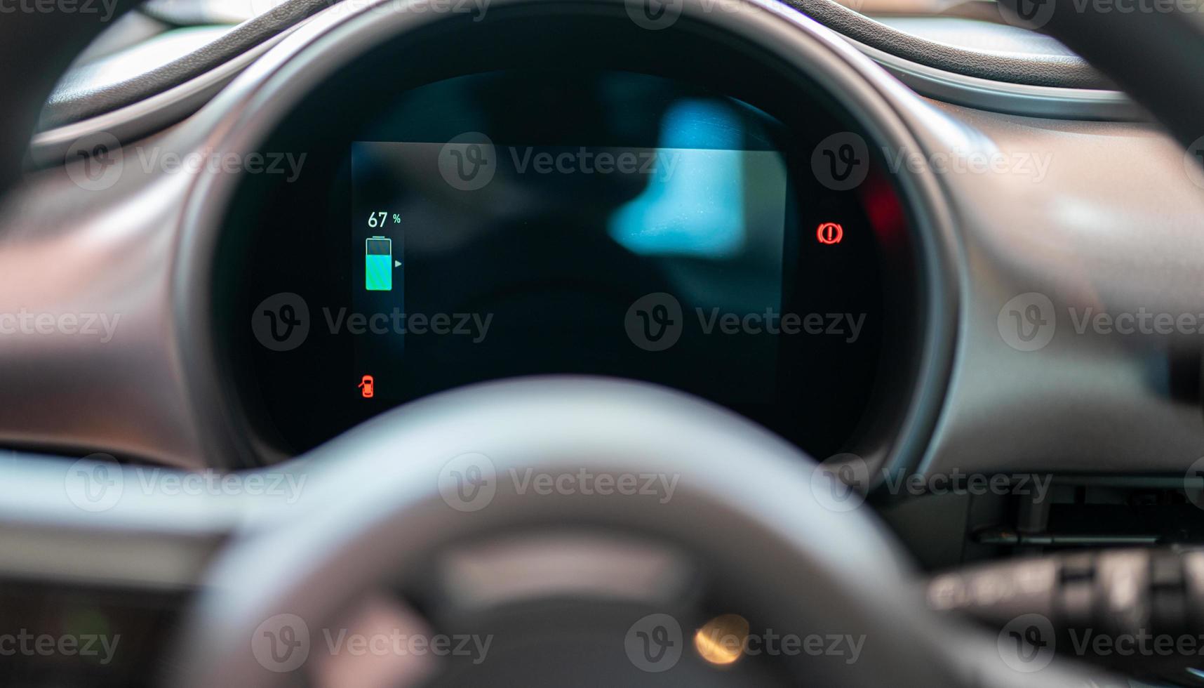 Electric car dashboard showing battery percentage. photo