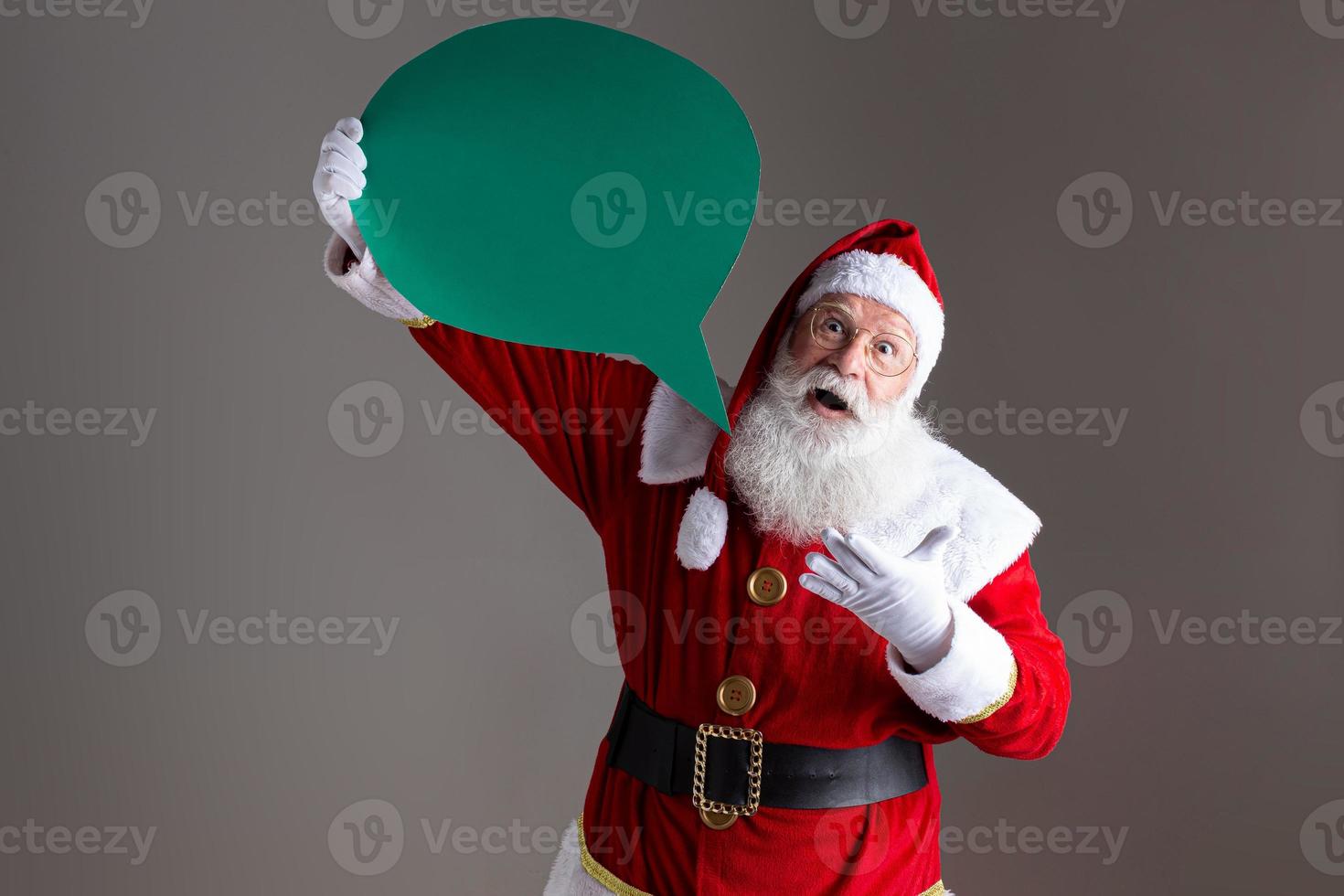 Santa Claus holding blank text balloon. photo