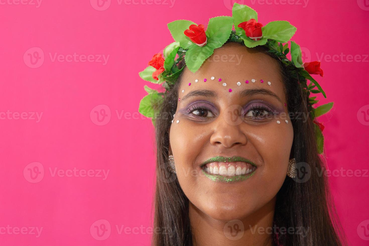 happy young woman with mask and confetti at carnaval party. Brazilian Carnival photo