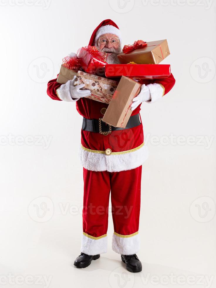 Santa Claus offering a gifts to the camera. Receiving Christmas presents. New Year parties. photo