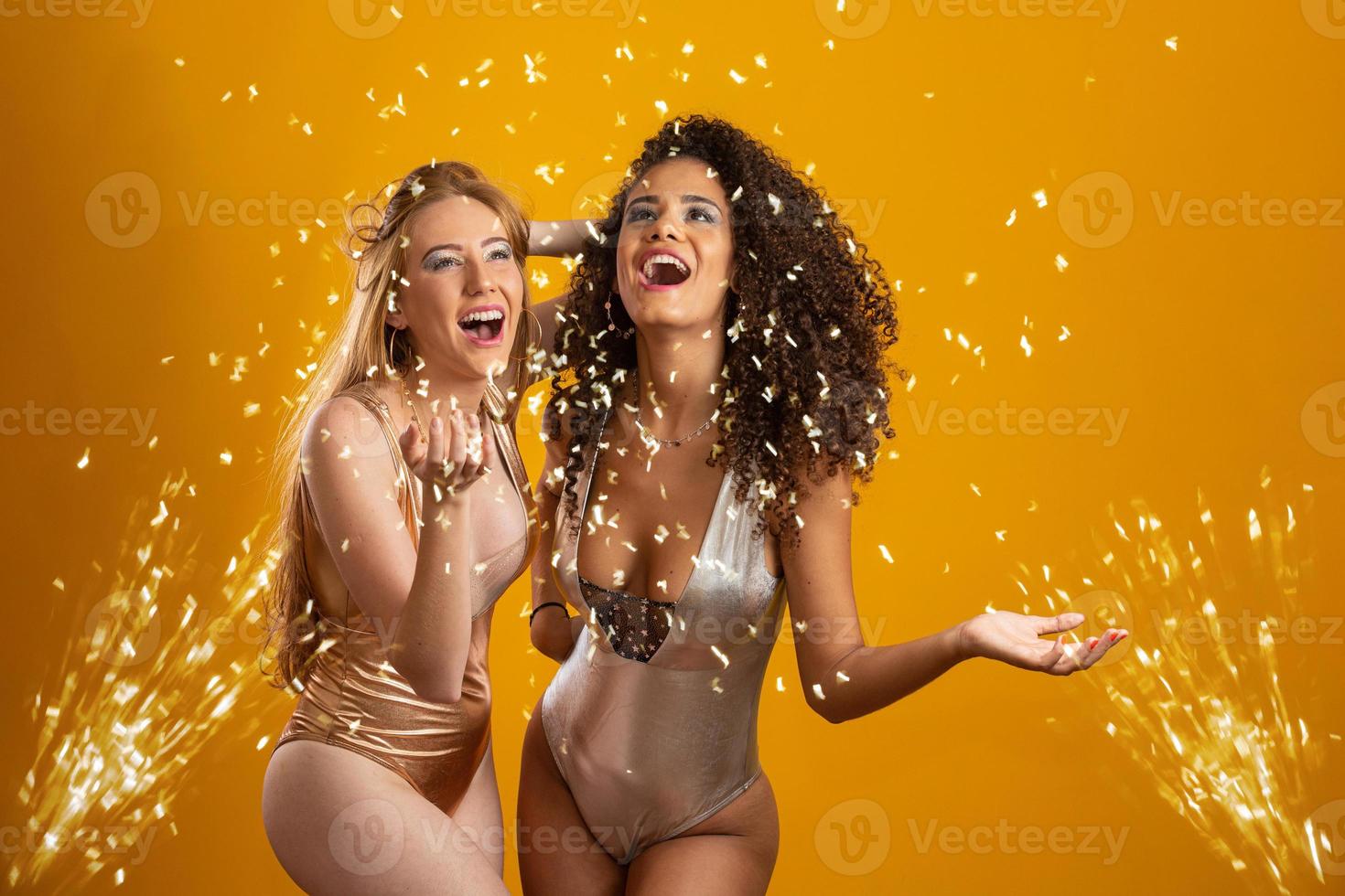 Beautiful woman dressed for carnival night. Smiling woman ready to enjoy the carnival with confetti. photo
