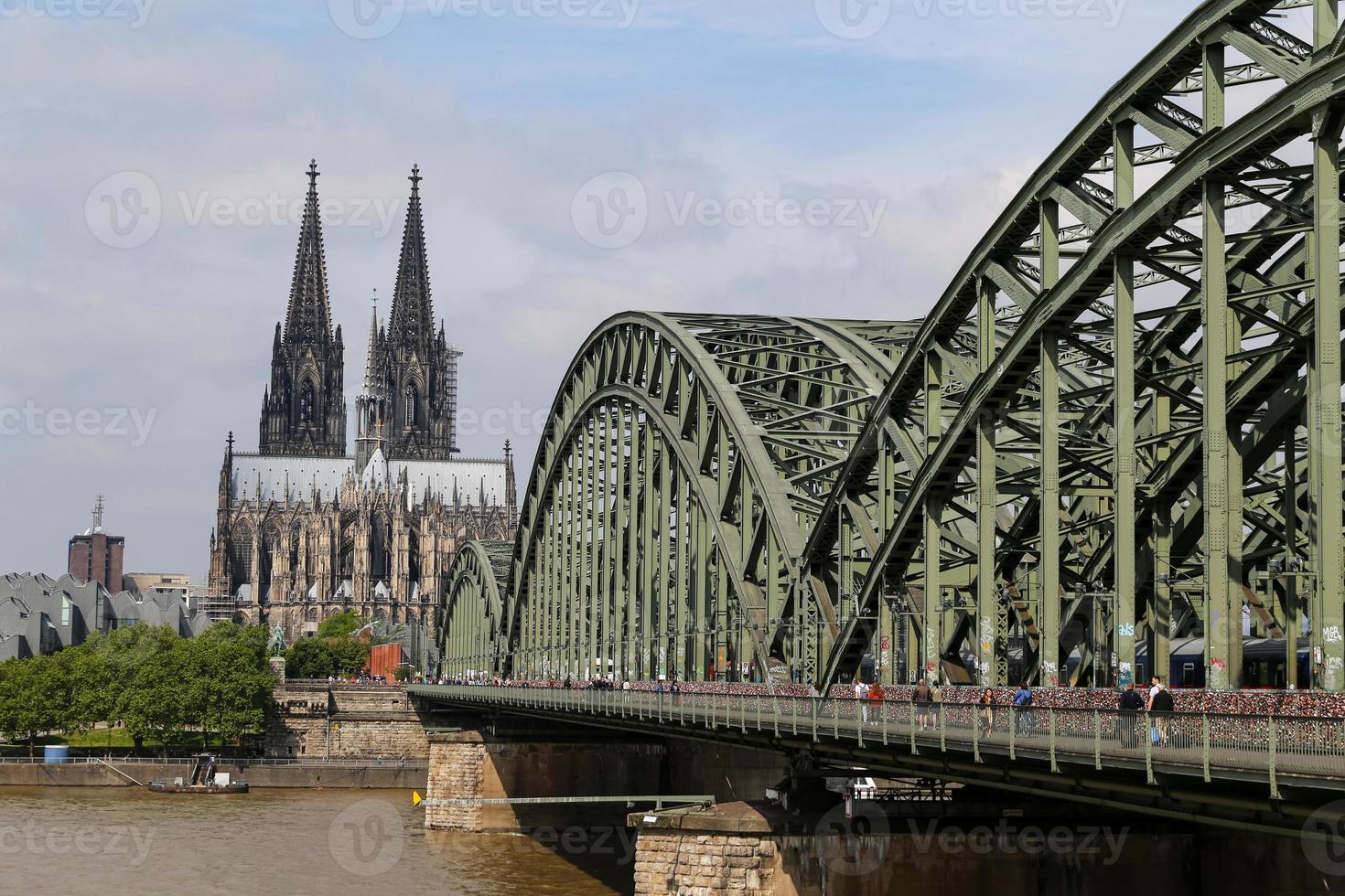 Hohenzollern Bridge and Cologne Cathedral in Cologne, Germany photo