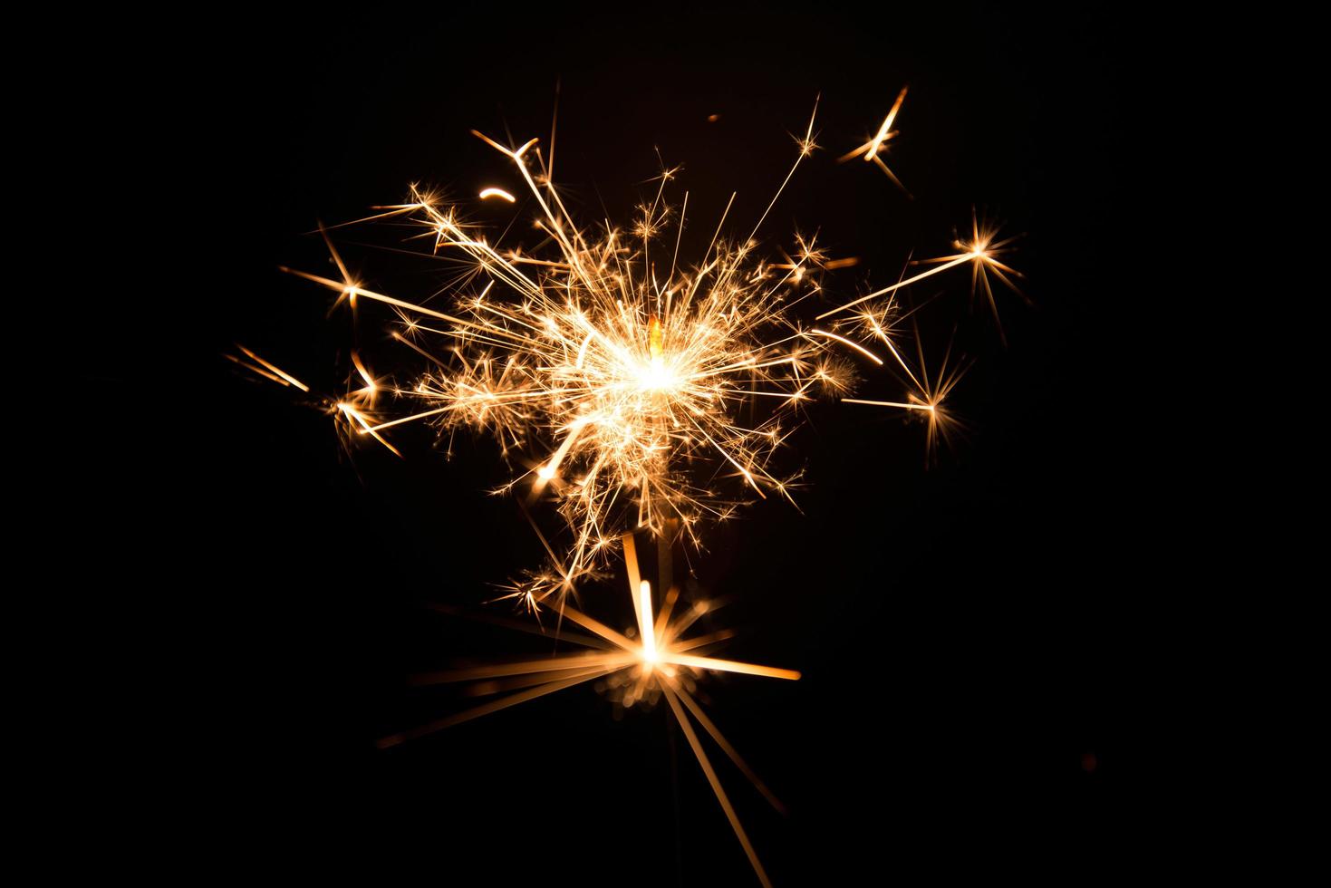 New year party sparkler on black background photo