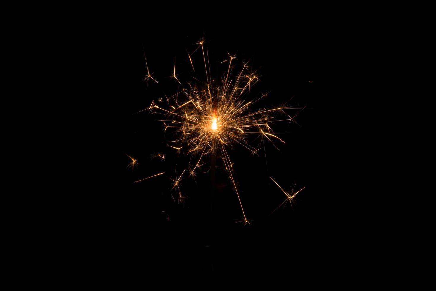New year party sparkler on black background photo