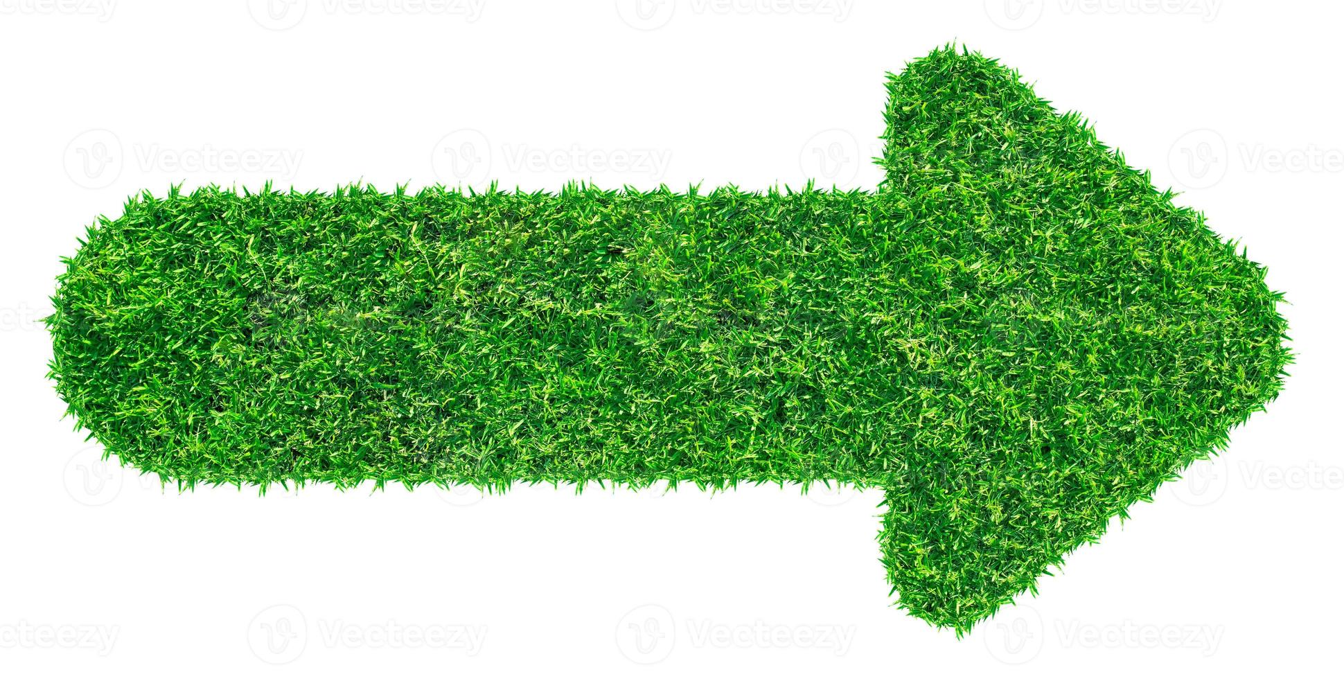 Arrow symbol from grass, isolated on white background photo