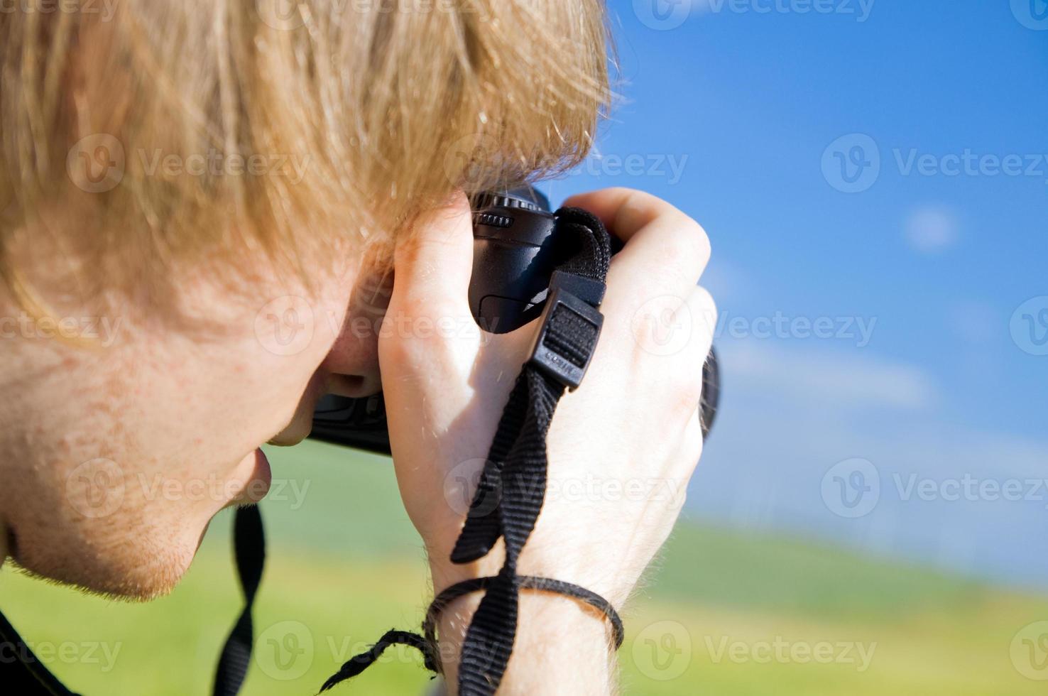Photographer taking pictures photo