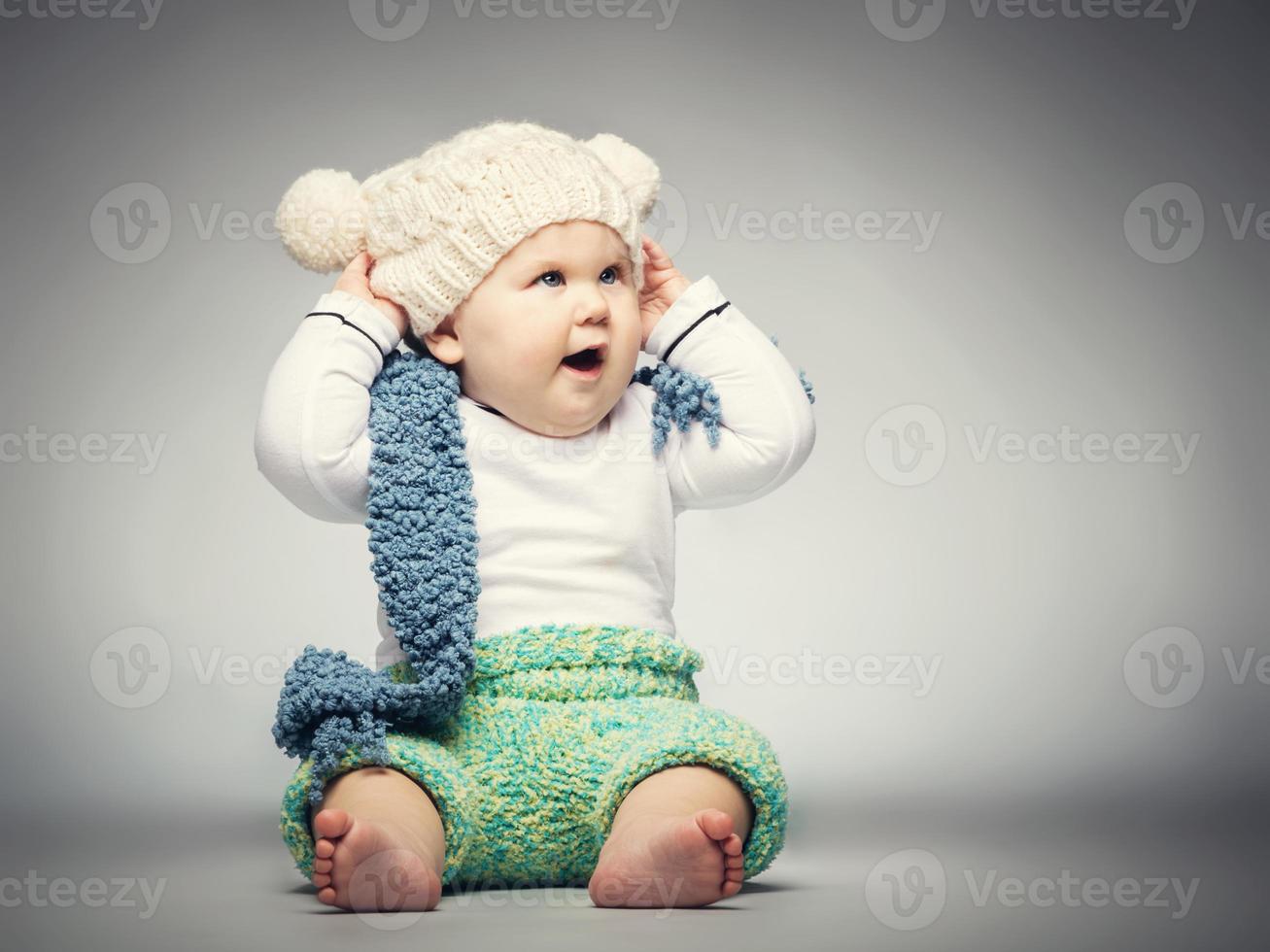 Happy boy in woolen clothes photo