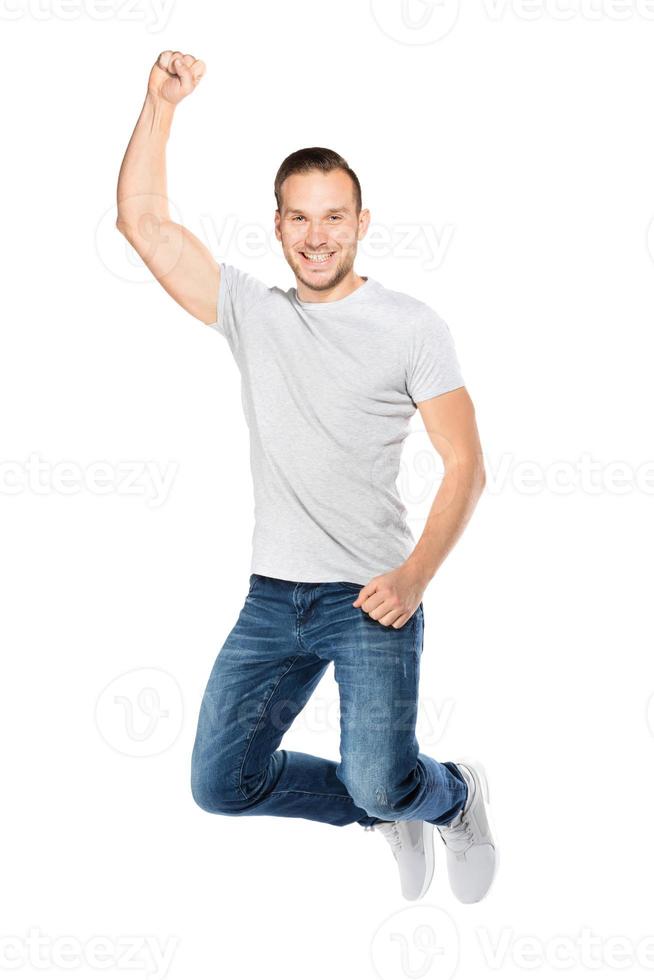 Young man jumping in a joyful expression. photo