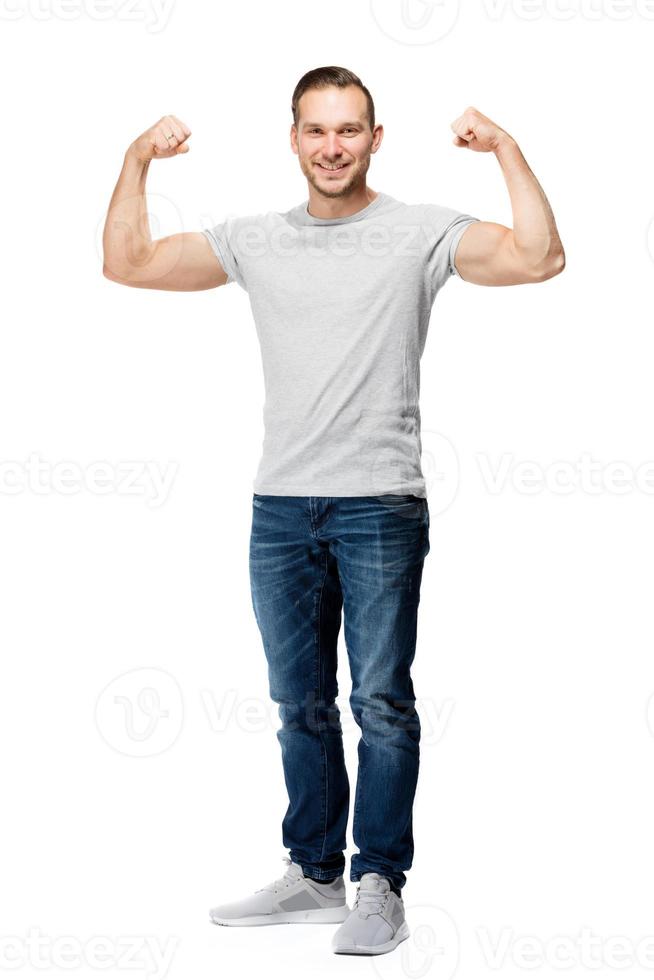 Happy positive man showing his strength. photo