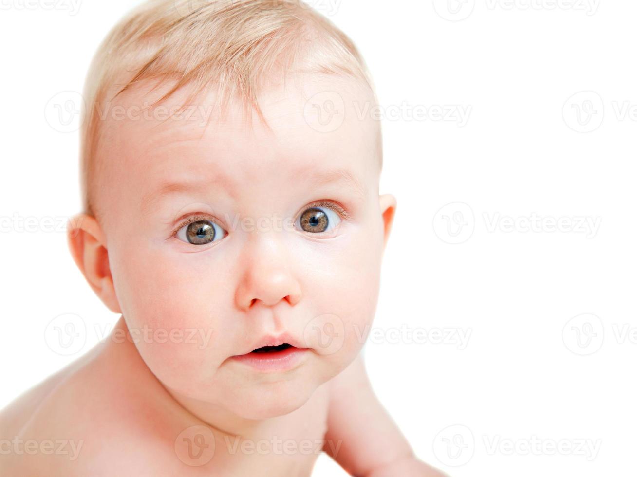 Cute baby with surprised face expression photo