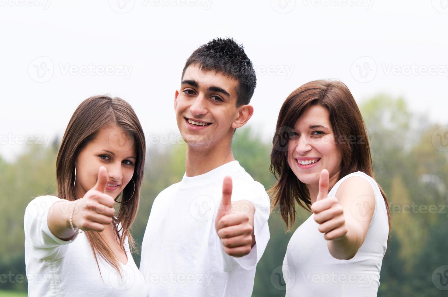 Happy friends giving okey sign photo