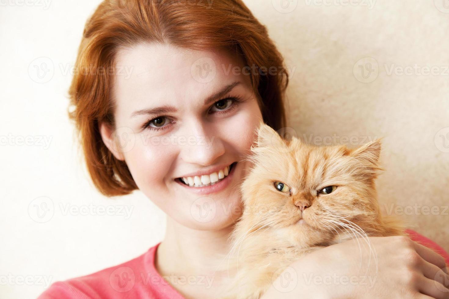 Young woman with Persian cat portrait photo