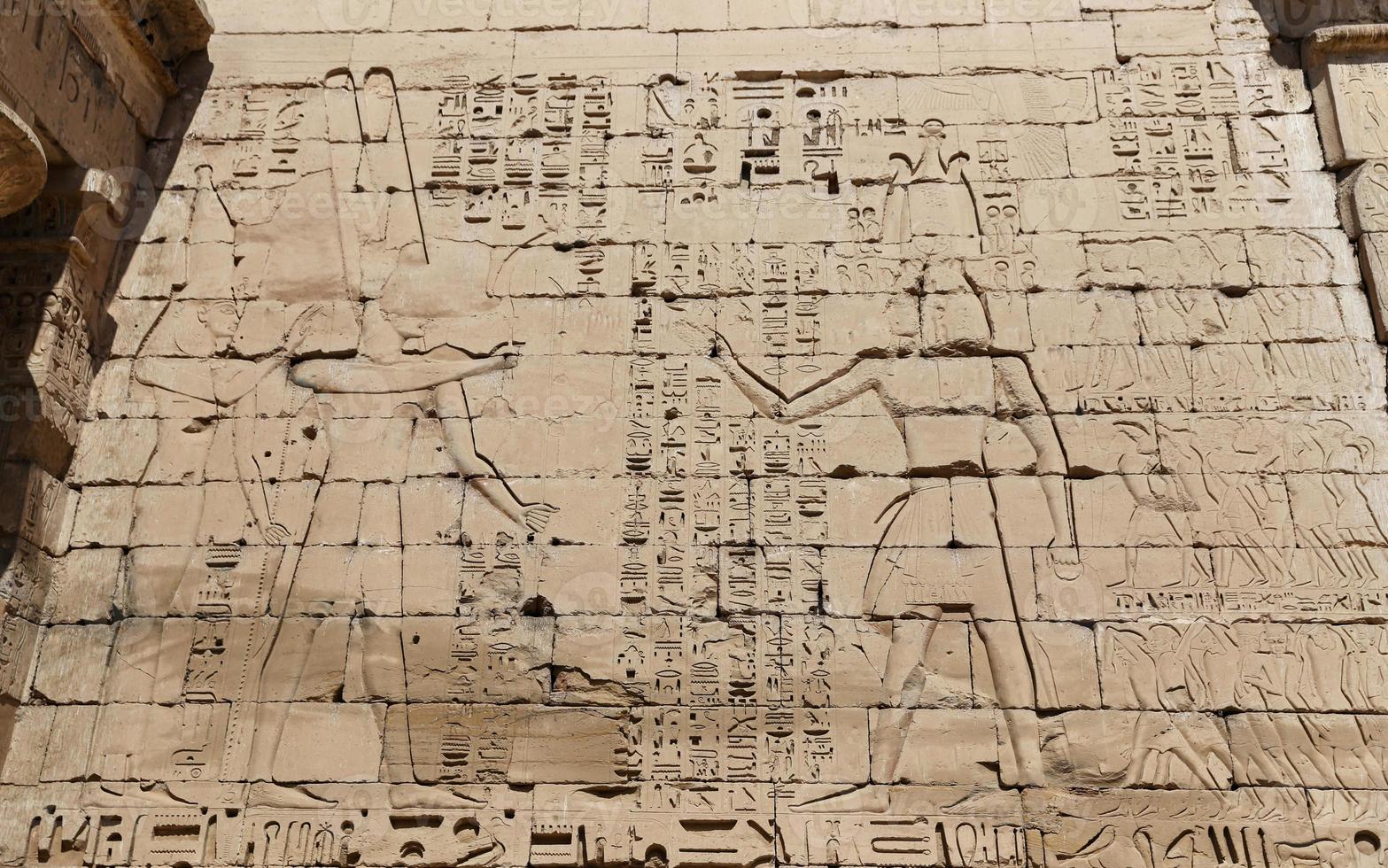 Egyptian Hieroglyphs in Medinet Habu Temple, Luxor, Egypt photo