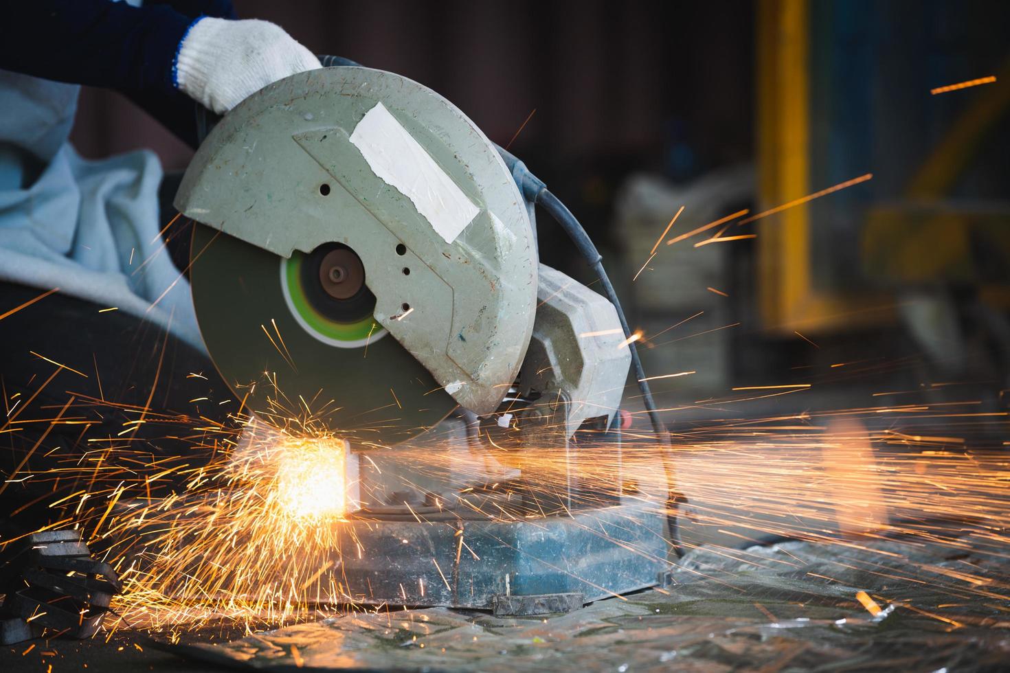 Cutting of a steel with splashes of sparks at construction site. photo