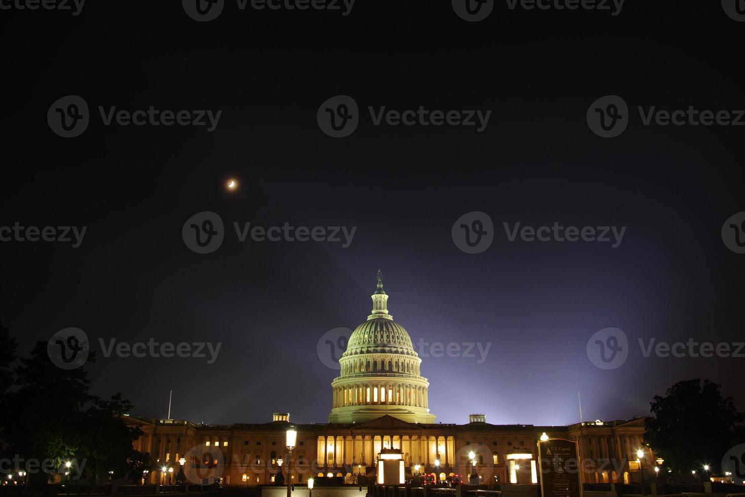 The U.S. Capitol is shrouded in haze following the annual Independence Day fireworks show on July 4, 2022. photo