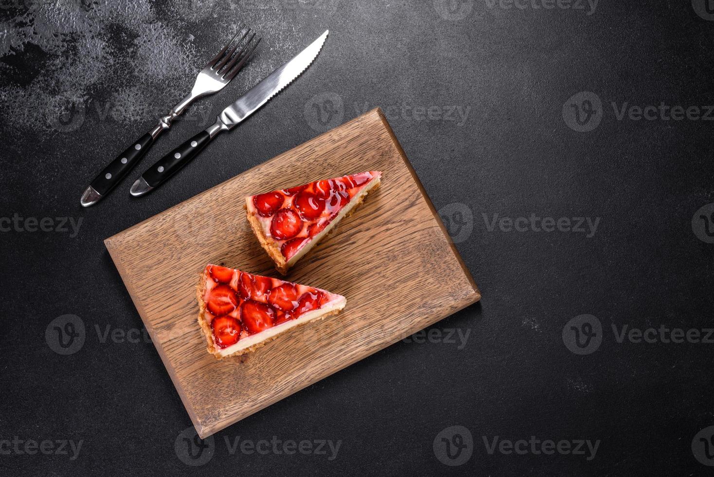 Delicious strawberry tart on concrete background, top view, copy space photo