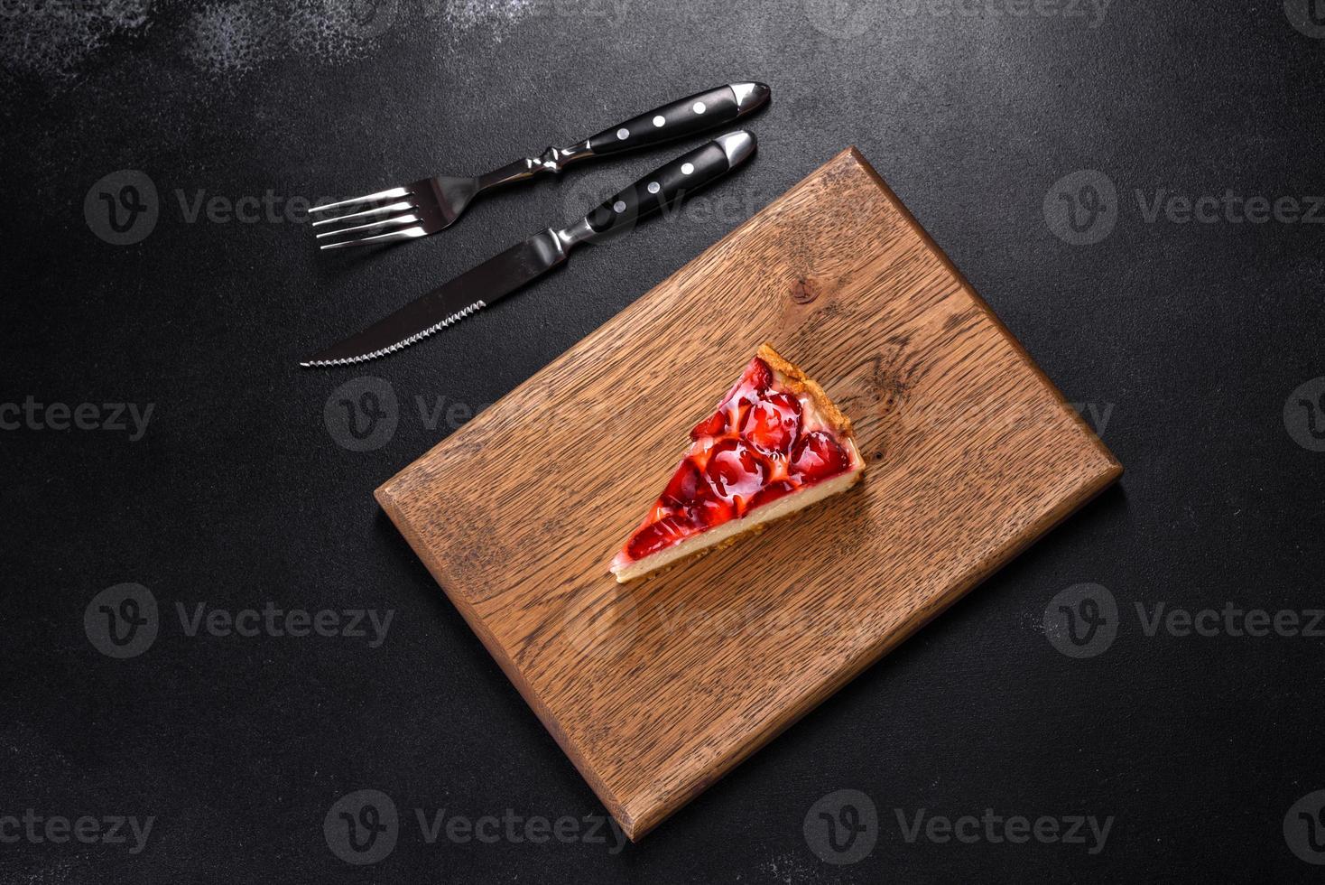 Delicious strawberry tart on concrete background, top view, copy space photo