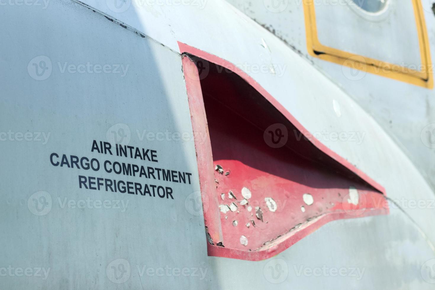 Air intake cargo compartment refrigerator decal on an old aircraft. photo