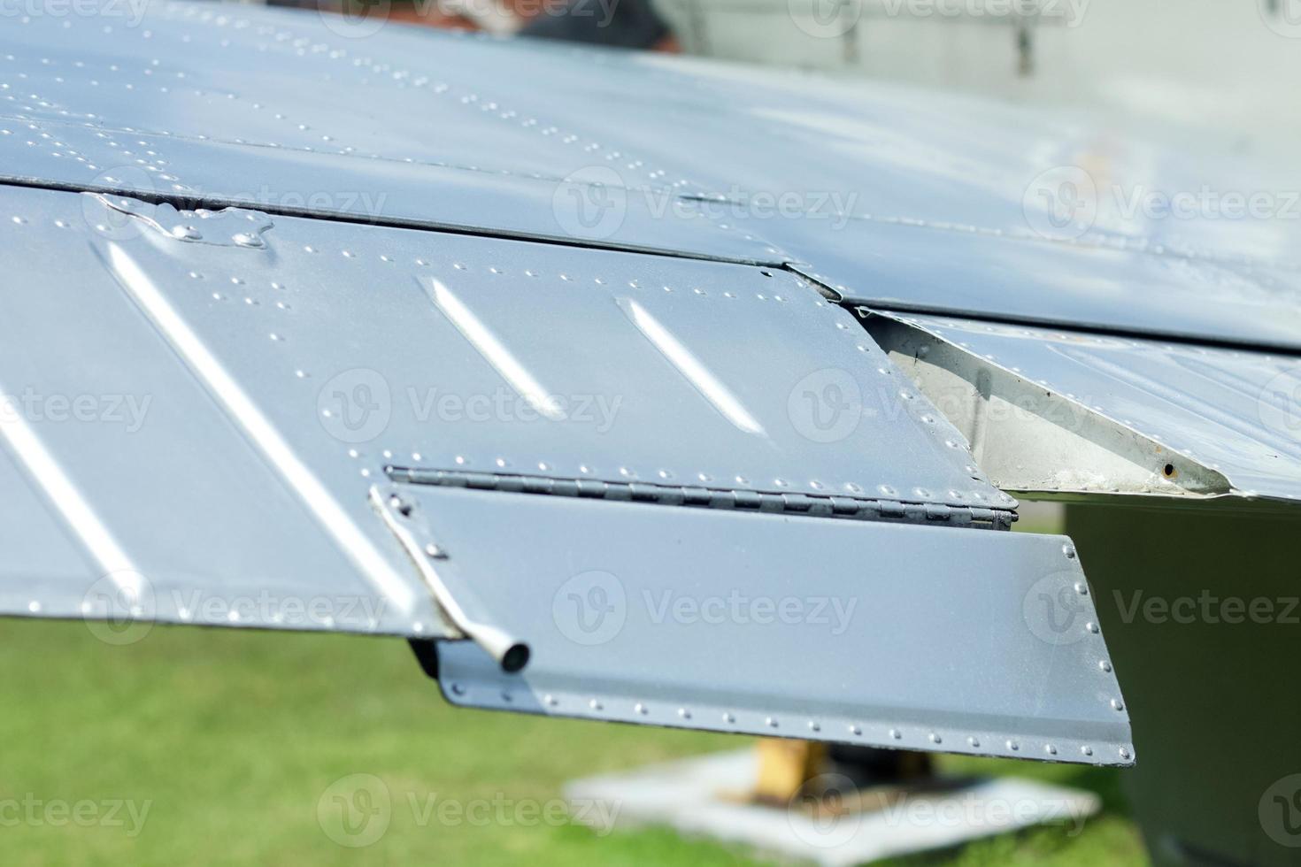 Close up image of an airfoil of an old aircraft. photo