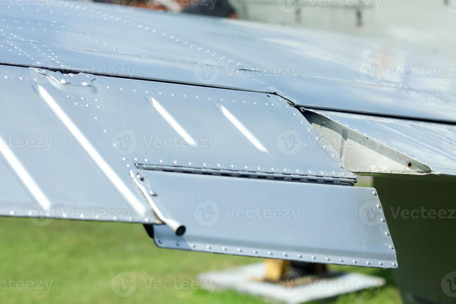 Close up image of an airfoil of an old aircraft. photo