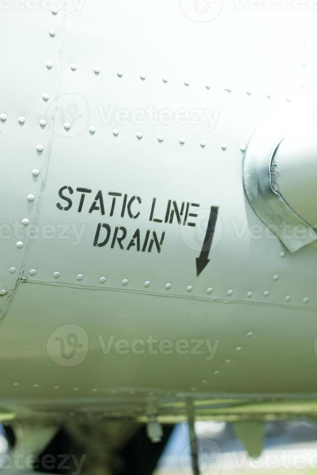 Static line drain decal on an old aircraft. photo