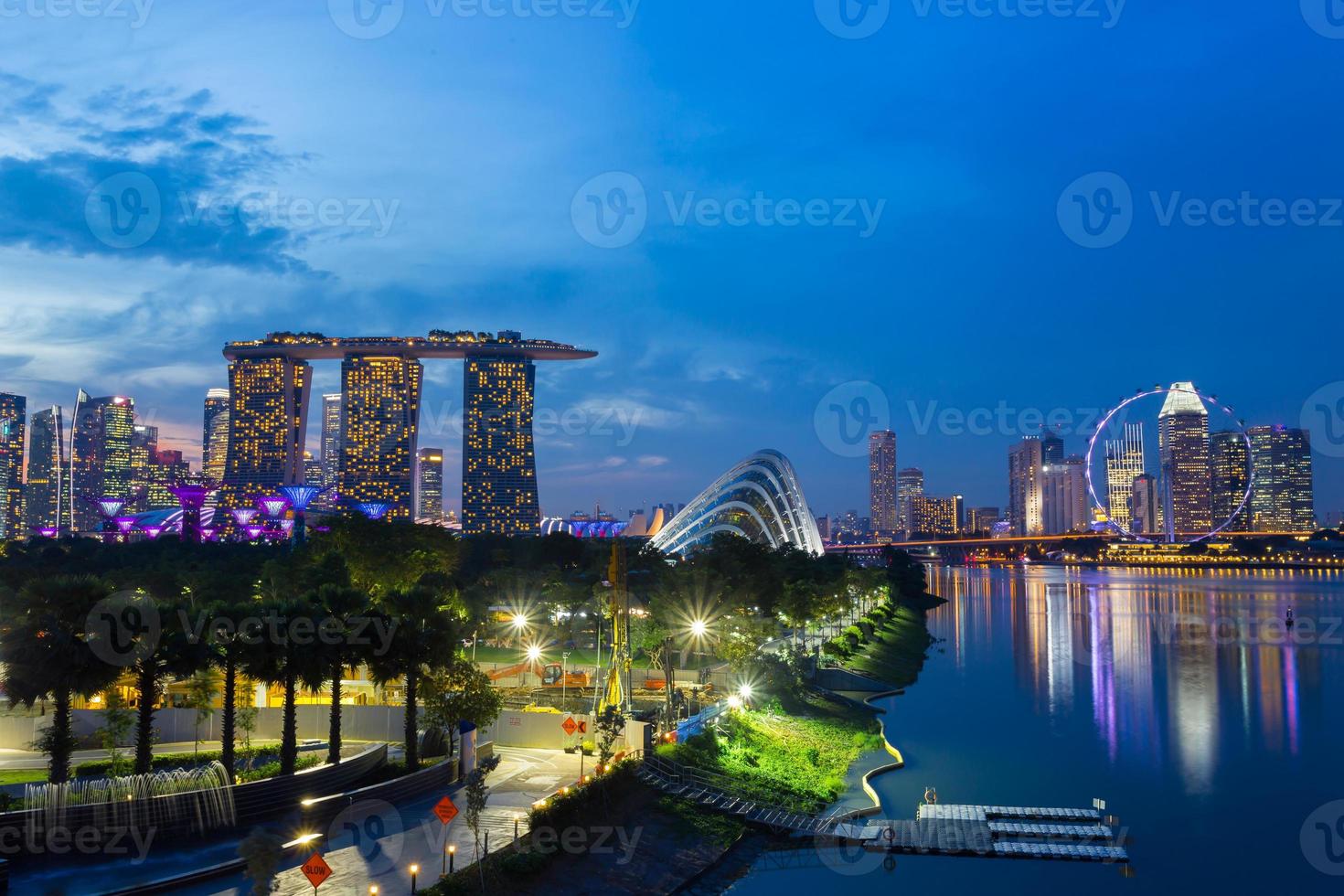 Cityscape of Singapore skyline at twilight time with all landmark. Marina Bay is a bay located in the Central Area of Singapore photo