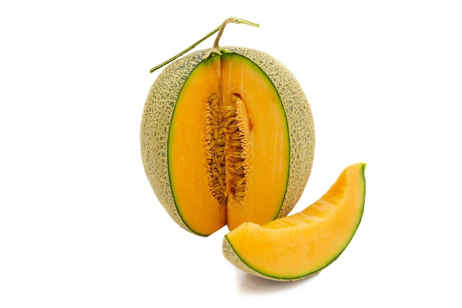 Closeup melon bright colors that is turned and pieces isolated on white background. photo