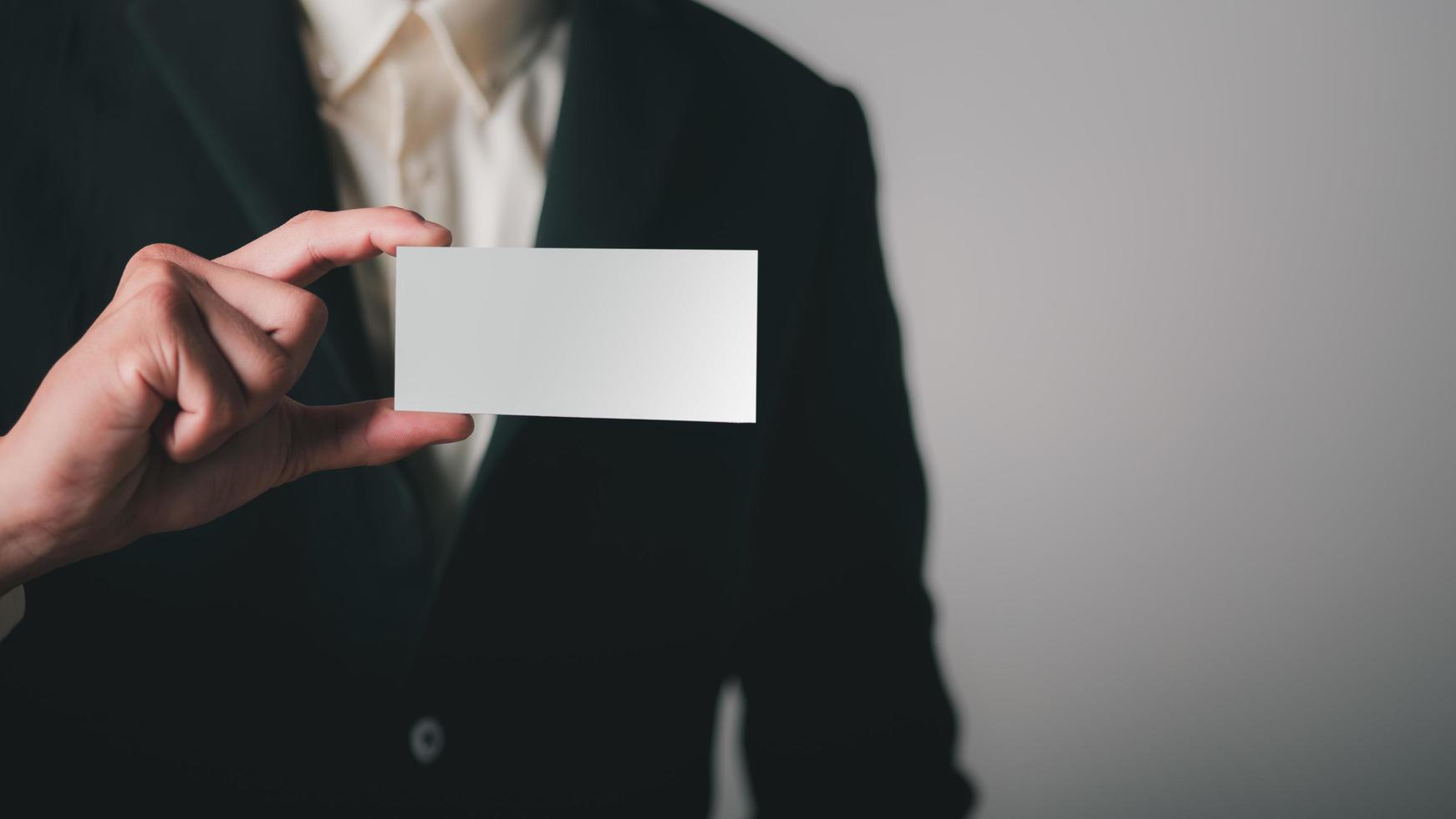 businessman with a piece of paper in his hand photo