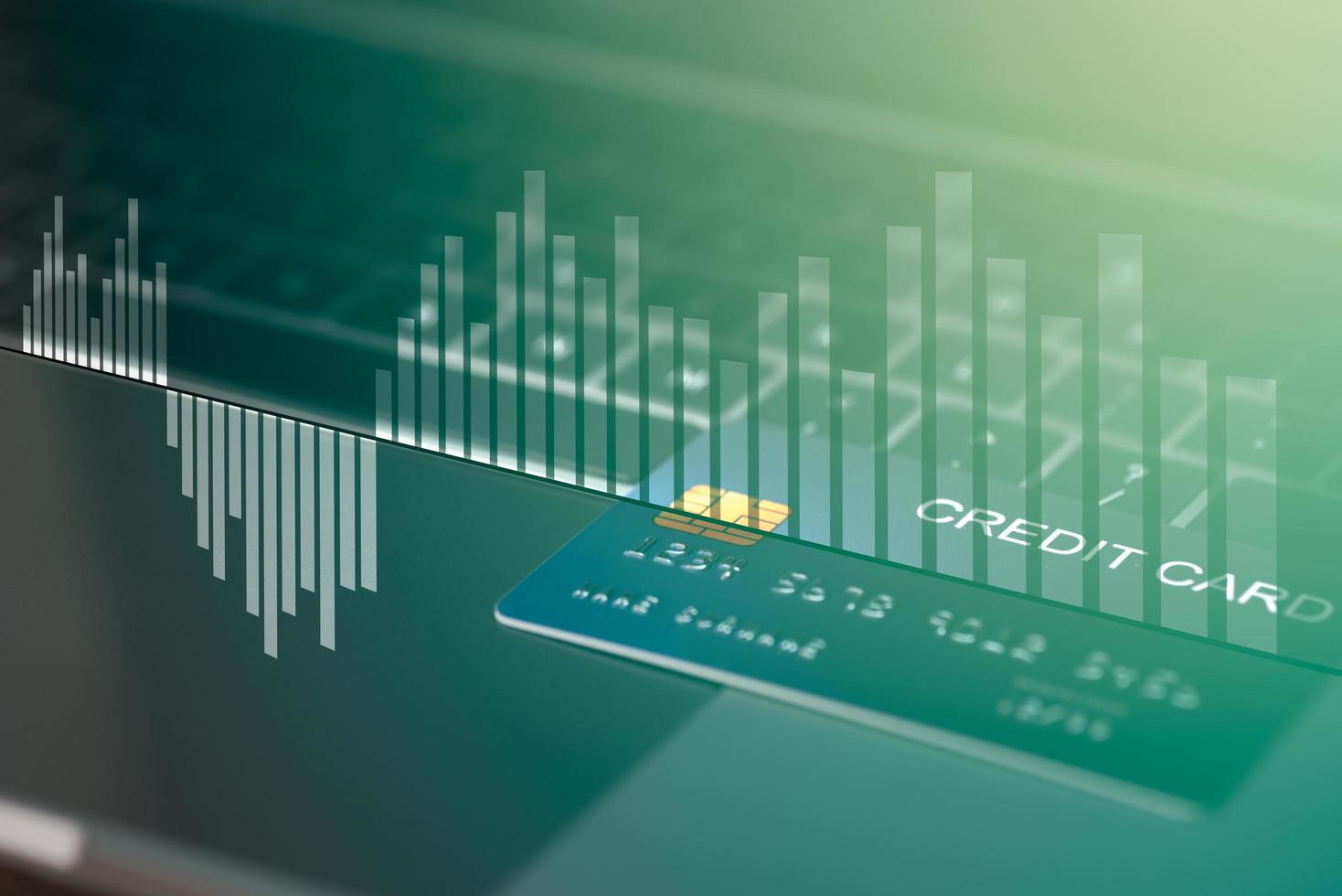 A credit card placed on a laptop computer photo