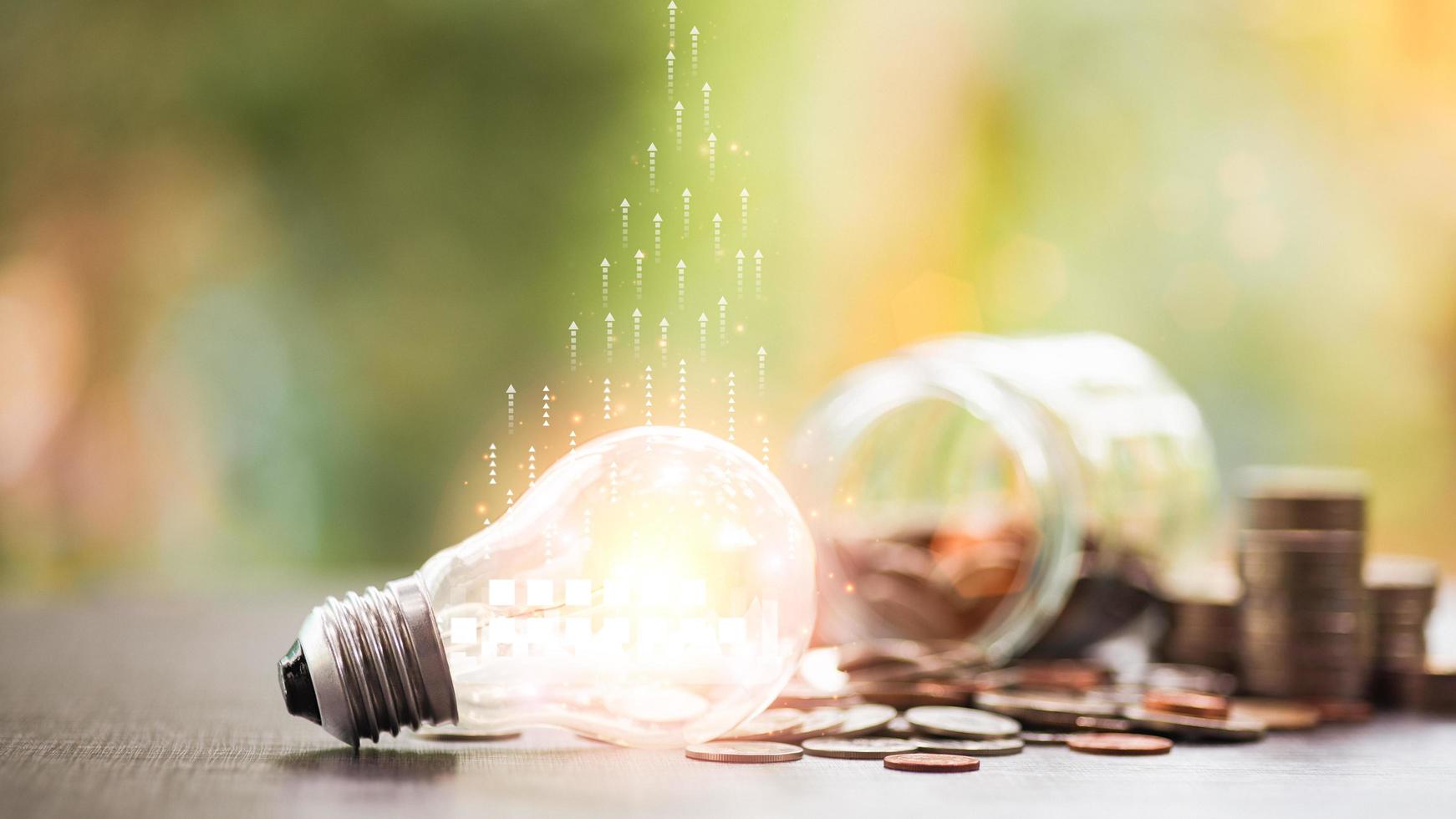 Light bulbs and coins, ideas planning to save. for the development of investment ideas by using innovation to manage a business to grow and succeed with a focus on profit, financial and banking, photo