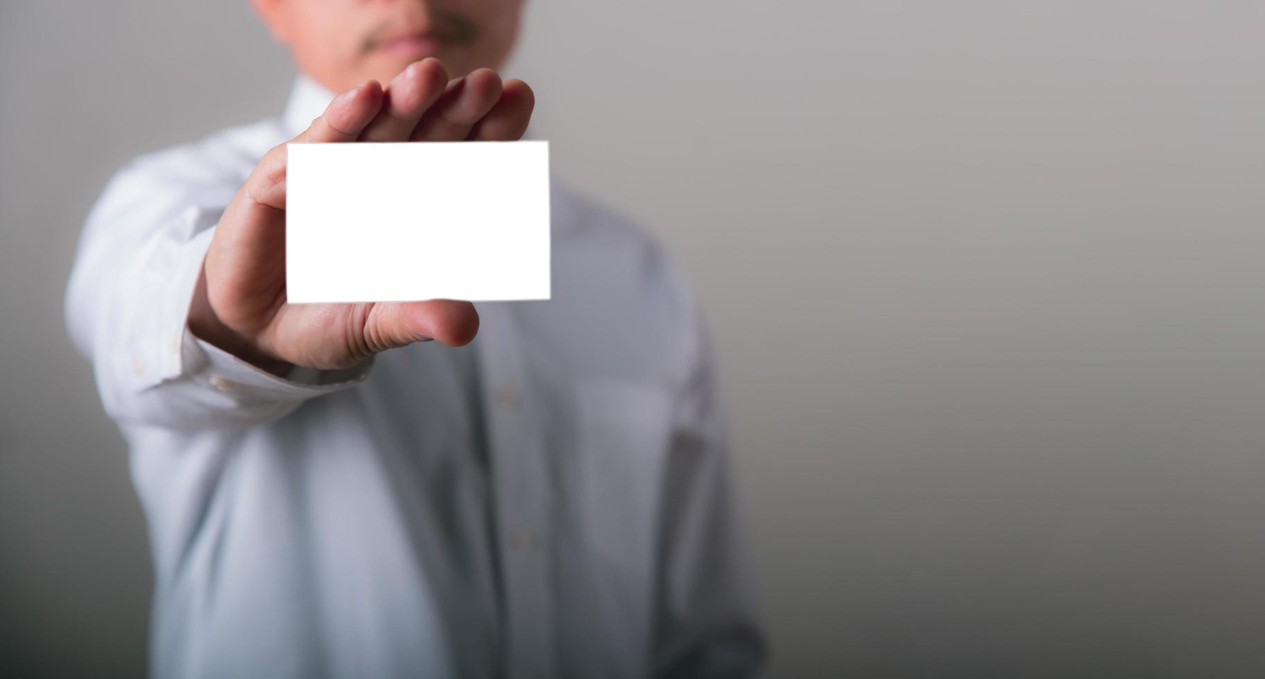 piece of white paper in the hand of a businessman photo