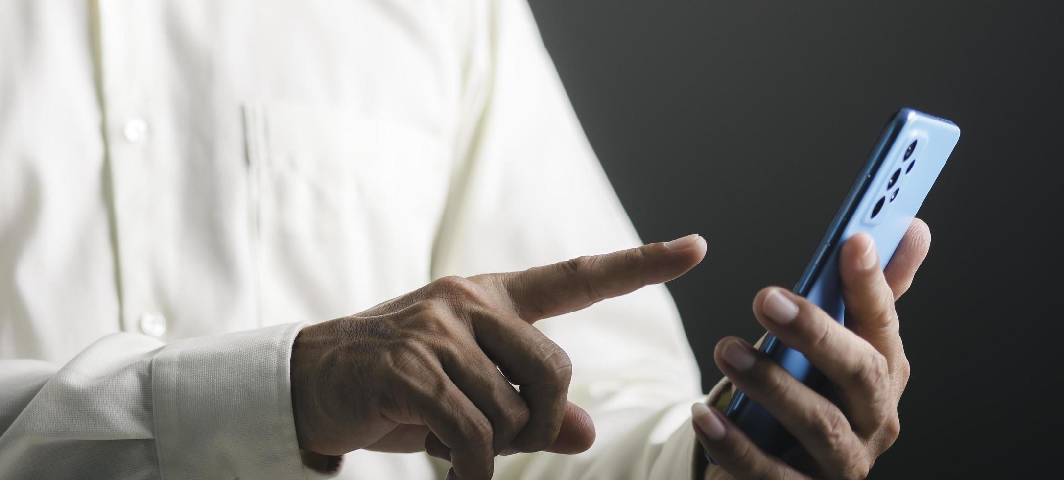 young businessman using mobile phone to make business communication through modern network systems photo