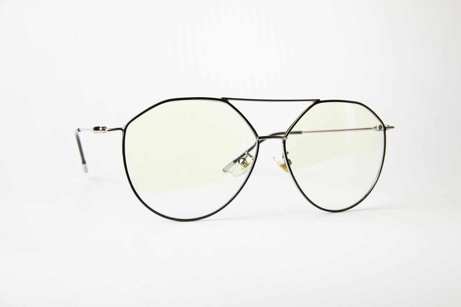 Eyeglass frames on white background photo