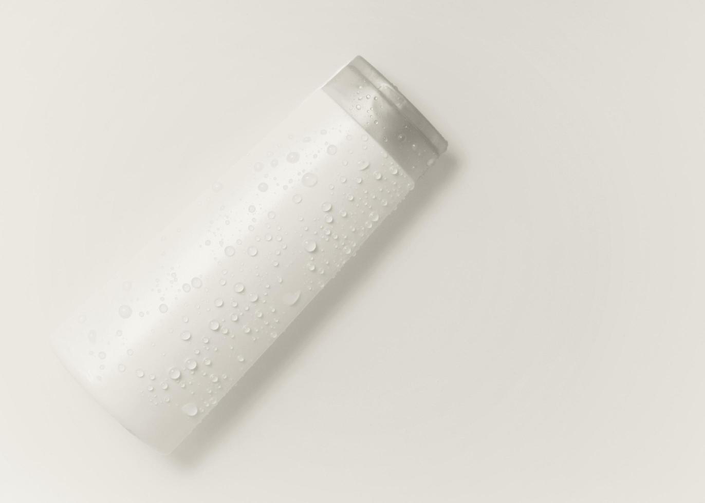 White cosmetic bottle on the water surface. Blank label for branding mock-up. Flat lay, top view. photo