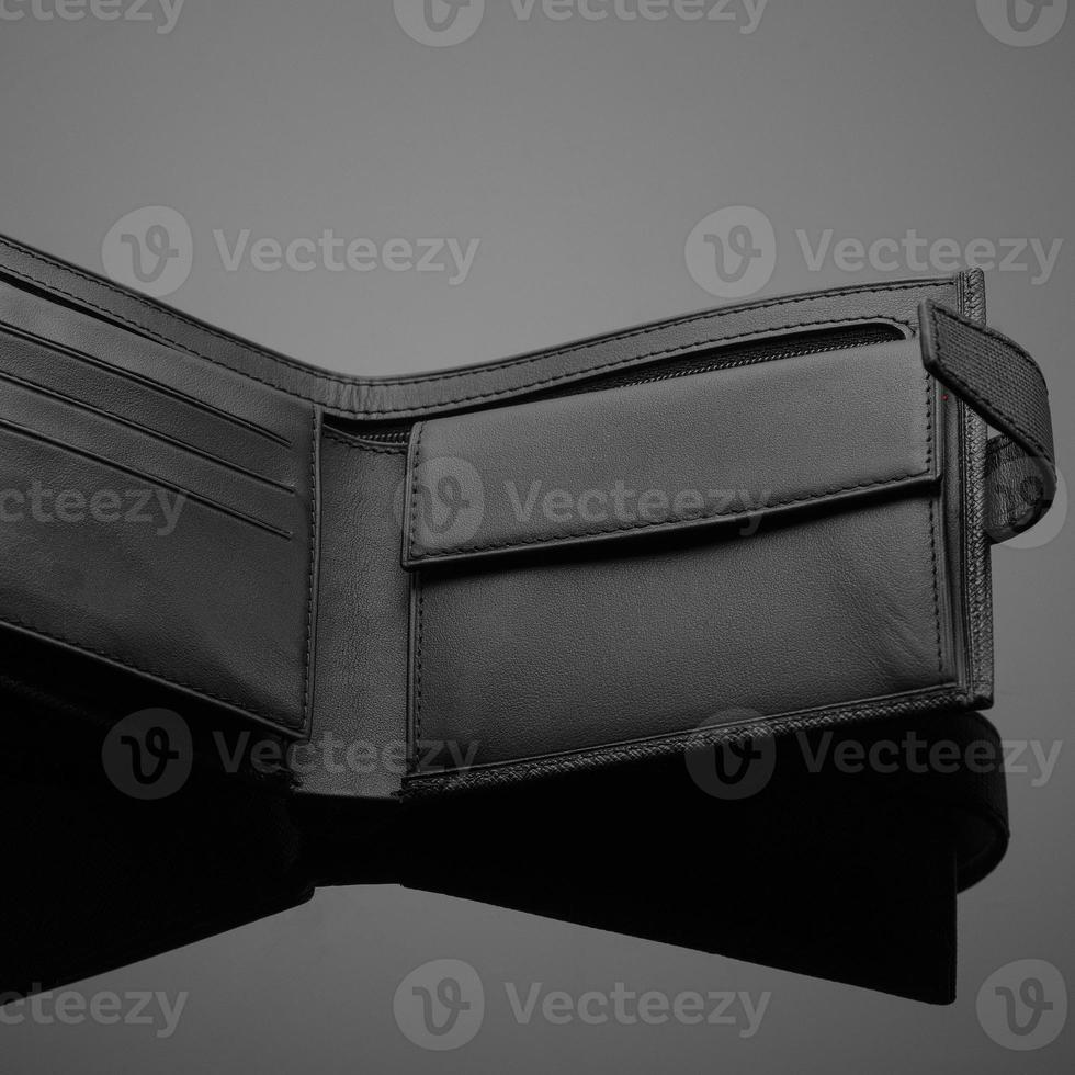 A closeup of a fashionable leather wallet on a dark background photo