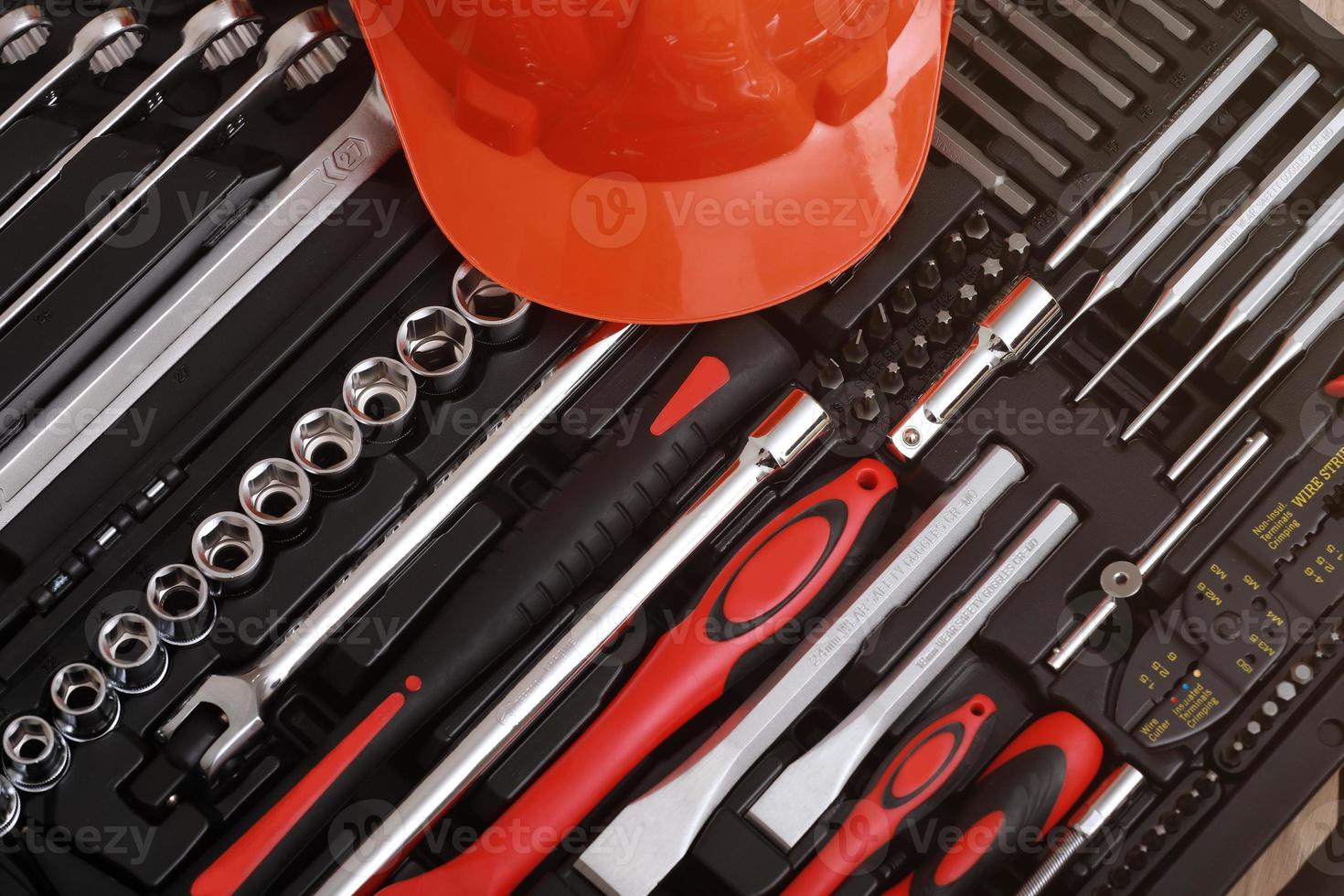 Toolbox, tools kit detail and orange protective helmet close up. instruments. set of tools. car tool kit. tool set background. instruments for repair. photo