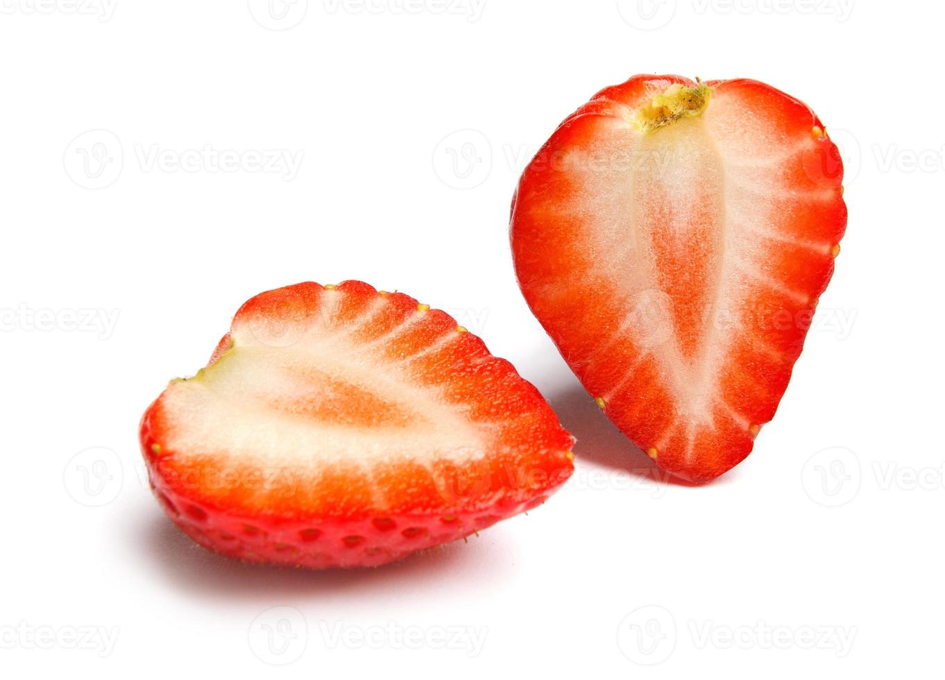 Strawberry. Cut strawberries into pieces. Strawberry slices flying in the air. Fresh natural strawberry isolated . photo
