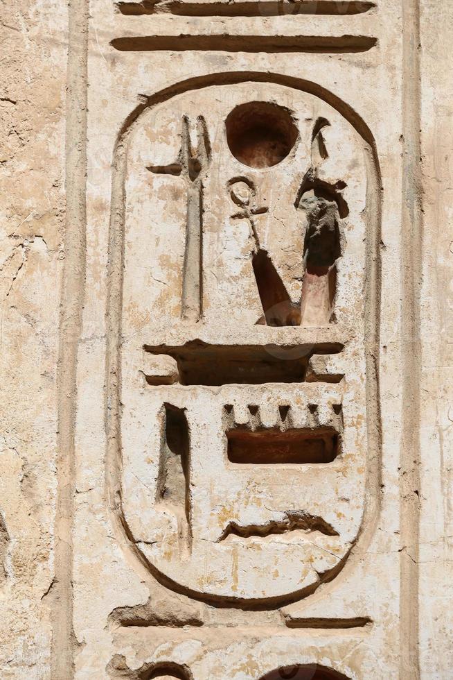 Egyptian Hieroglyphs in Medinet Habu Temple, Luxor, Egypt photo