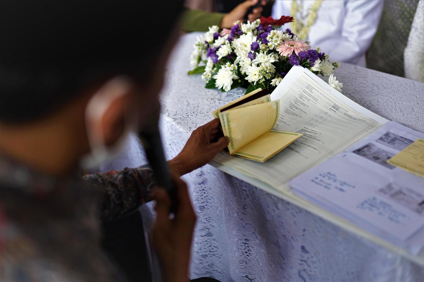 Bandung, West Java, Indonesia, 2021- Groom in a welcoming ceremony at an Indonesian traditional wedding. photo