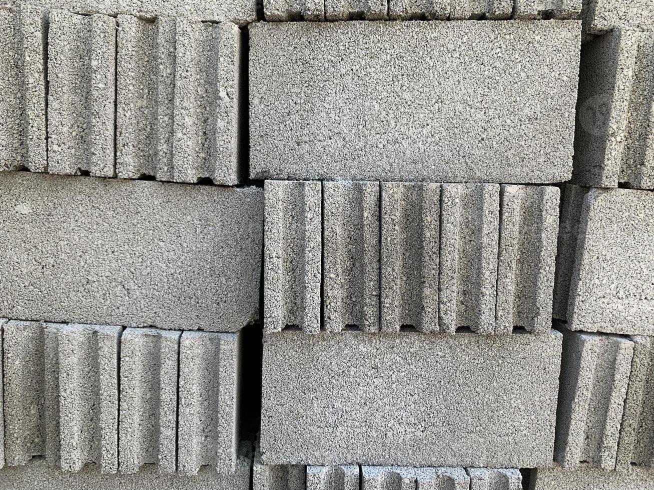 collection of cement block or brick lined up in warehouse photo