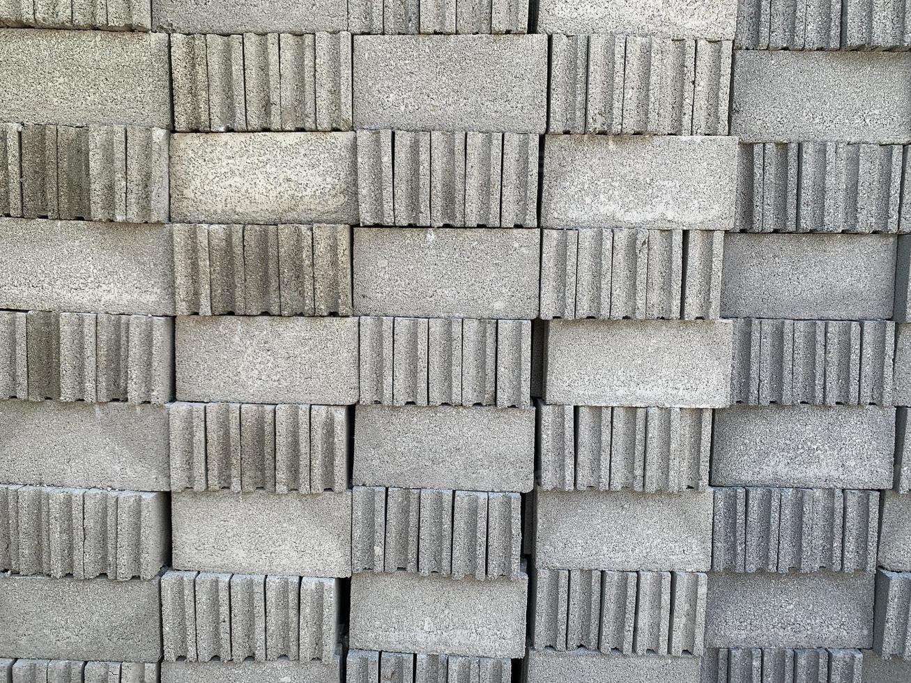 collection of cement block or brick lined up in warehouse photo