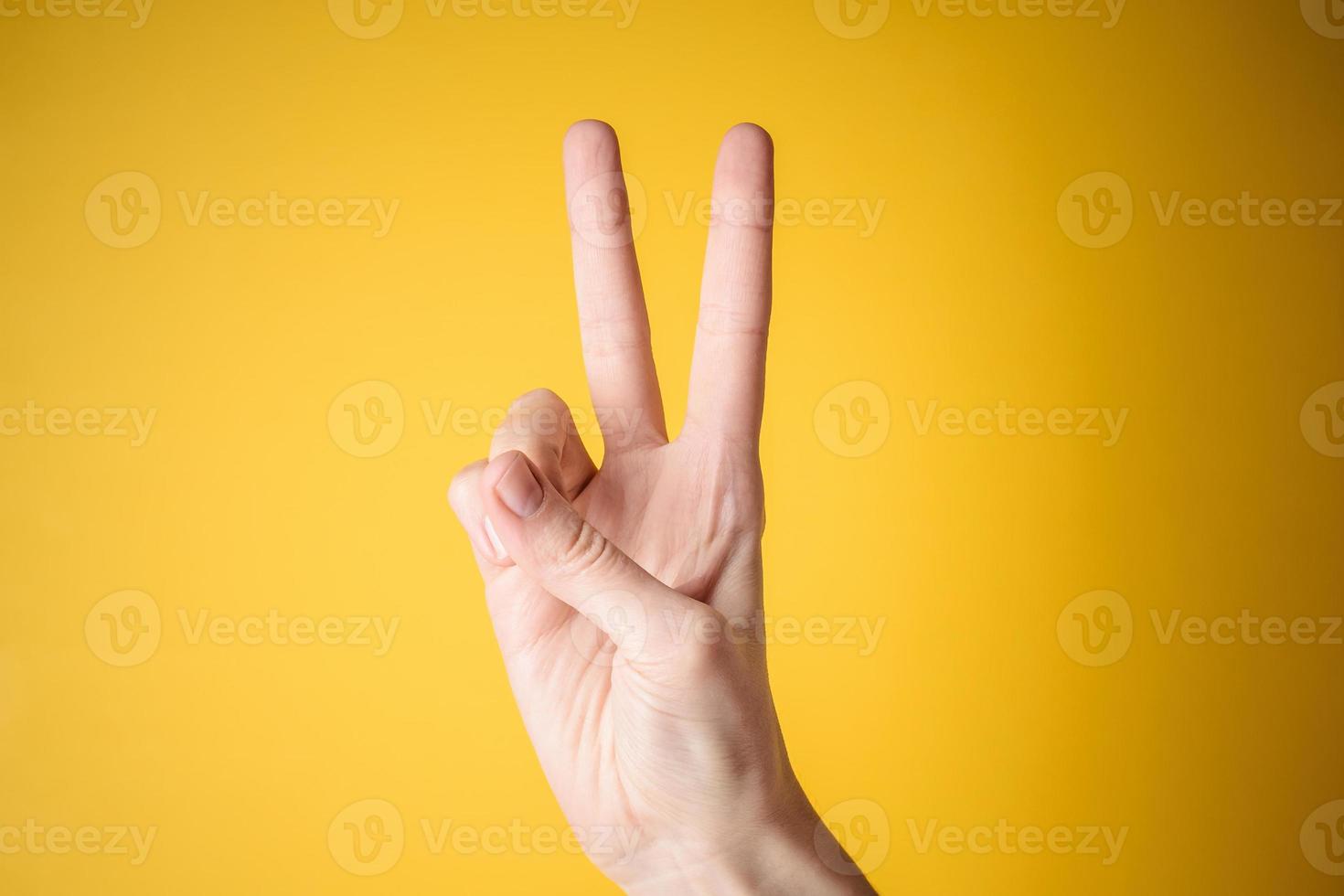 woman hand victory gesture photo