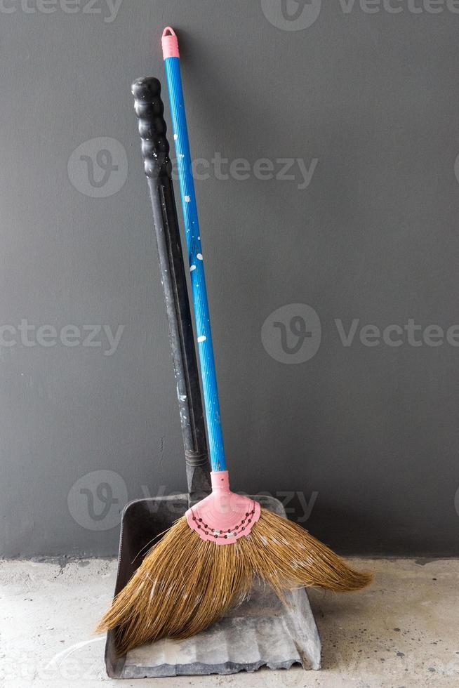 Old broom and dustpan photo