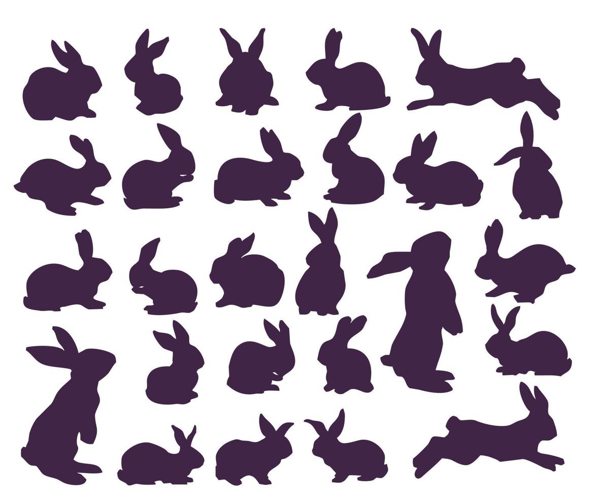 conjunto de siluetas de conejos y conejitos. 26 piezas vector