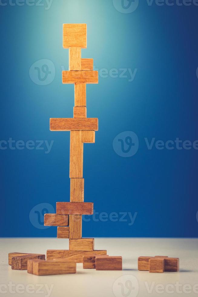 tower of wooden blocks on a blue background photo
