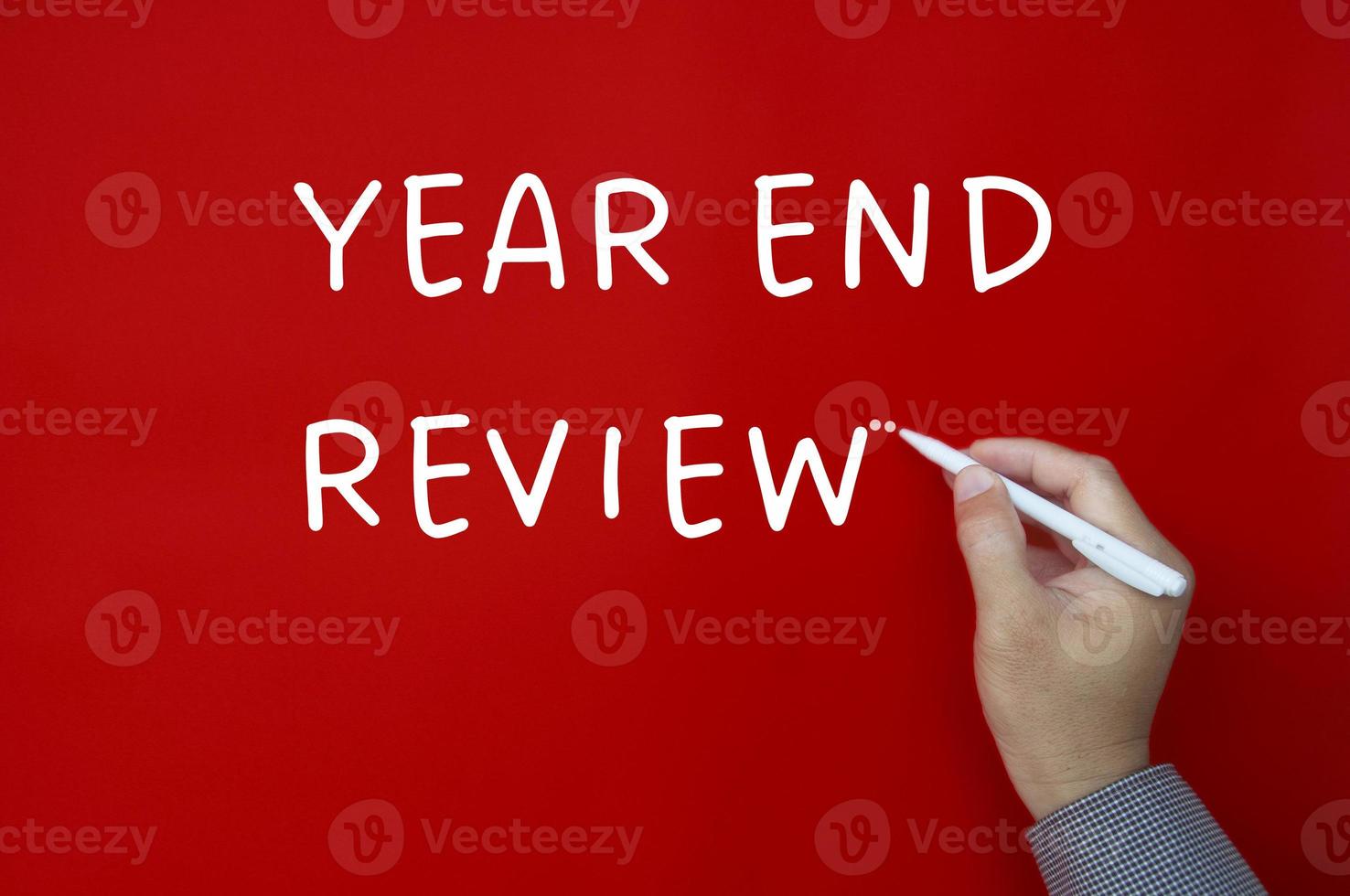Year end review text written on red cover background. Annual review concept photo