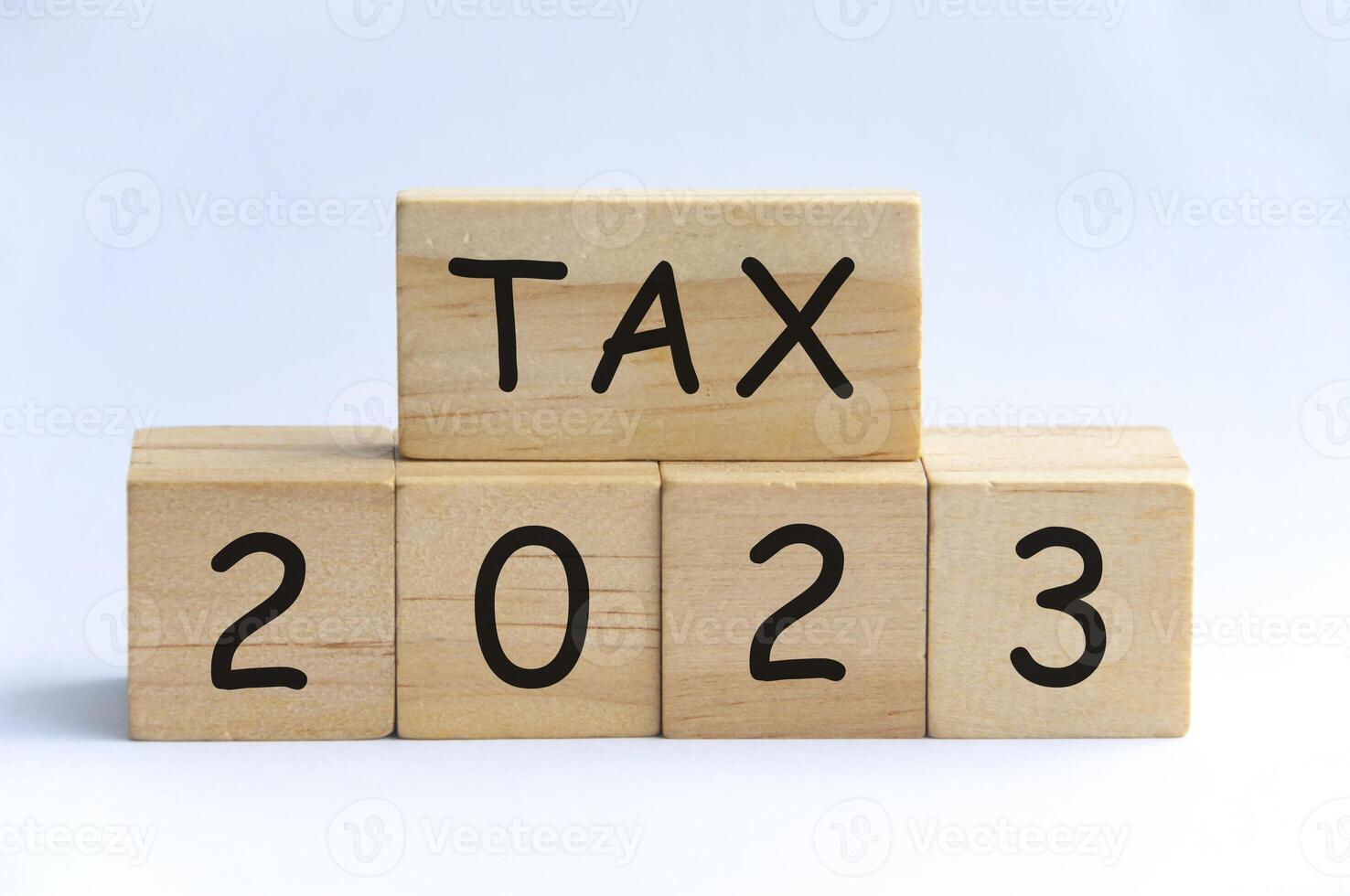 Tax 2023 on wooden blocks with white background. Tax 2023 concept photo