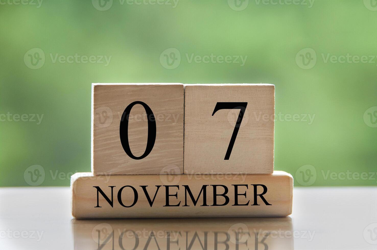 November 7 calendar date text on wooden blocks with copy space for ideas or text. photo